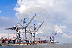 Lisbon, Portugal - International Port of Lisbon in the Tagus River with cranes and shipping containers