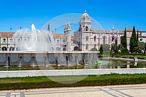 Lisbon, Portugal. Jeronimos Monastery or Abbey aka Santa Maria de Belem seen from Jardim da Praca do Imperio Garden photo