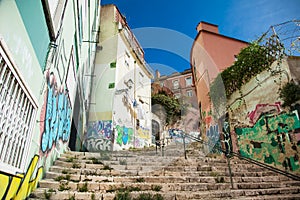 Old stone stairs in Lisbon, detail of stairs in an old street in an old neighborhood in Portugal