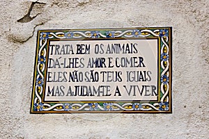 Lisbon, Portugal: popular block about the animals in tiles in a wall in Mouraria quarter