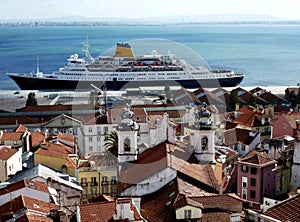 Lisbon roof tops and cruise ship by the Tagus or Tejo river