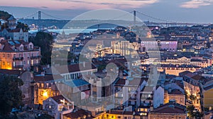 Lisbon after sunset aerial panorama view of city centre with red roofs at Autumn day to night timelapse, Portugal