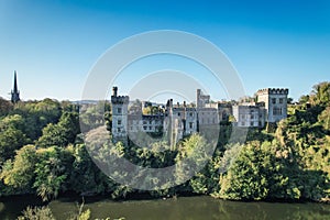 Lismore Castle, County Waterford, Ireland, on a tranquil spring day under a flawless blue sky