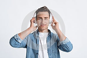 Listen favorite music concept. Guy in headphones