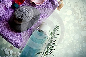 Spa concept on glass background - spa sones, towel and  body oil photo