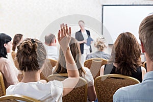 Listener raising hand to ask