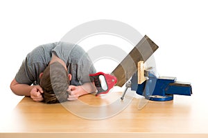 Listless teenager in professional training with saw photo