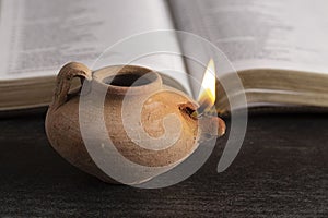 Lit Ancient Oil Lamp with an Open Bible Thy Word is a Lamp Unto My Feet