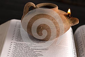 Lit Ancient Oil Lamp with an Open Bible Thy Word is a Lamp Unto My Feet