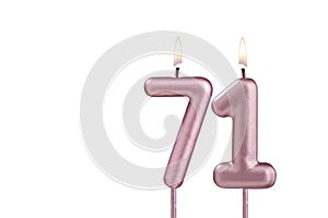 Lit birthday candle - Candle number 71 on white background