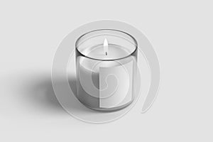 Lit candle in glass jar isolated on white background