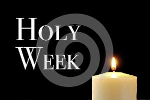 A lit candle and the text holy week