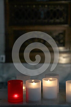 Lit candles inside a church, detail