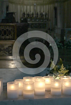 lit candles inside a church