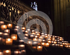 Lit Candles inside church Notre Dame de Paris, France