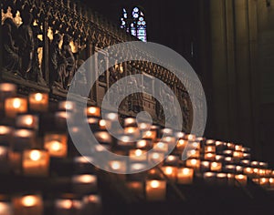 Lit Candles inside church Notre Dame de Paris, France