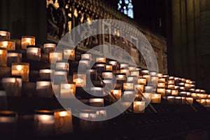 Lit Candles inside church Notre Dame de Paris, France