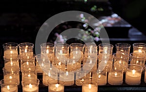 Lit candles to pray inside a church