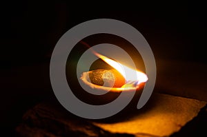 Lit diya or clay lamp on lying on the ground