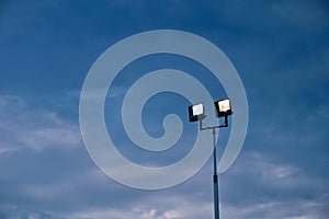 Lit Floodlights in Early Evening