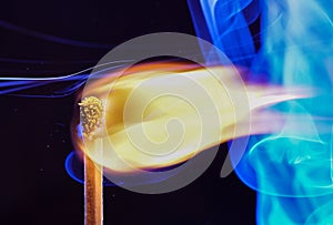 Lit matches and blown out in the studio photographed with colorful foils before the flashes