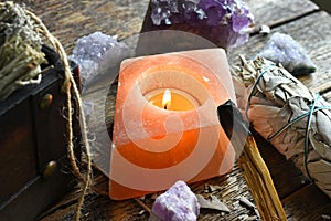 Lit Selenite Candle and white Sage