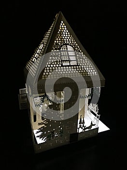 Lit Up 3D Holiday Paper House with a Christmas Tree Laser Cut