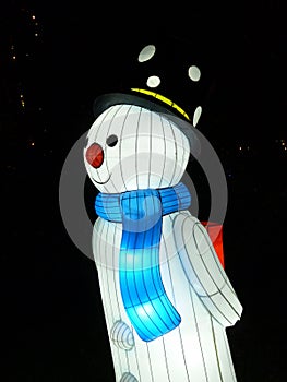 Lit up Snowman balloon at night