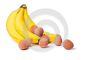 Litchi, bananas and mangoes, exotic fruits on a white background