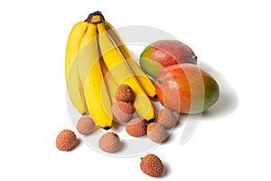 Litchi, bananas and mangoes, exotic fruits on a white background