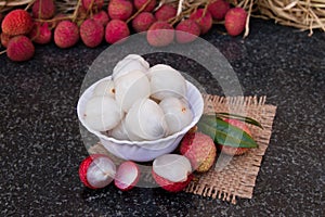 Litchi fruits. Fresh juicy lychee fruit on a glass plate. Peeled lychee fruit.