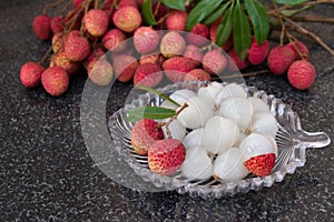 Litchi fruits. Fresh juicy lychee fruit on a glass plate. Peeled lychee fruit.