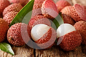 Litchi, lichee, lychee, or lichi, Litchi chinensis on old rustic wood background. horizontal photo