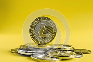 Litcoin coin dominates the background of multicolored coins of various cryptocurrencies
