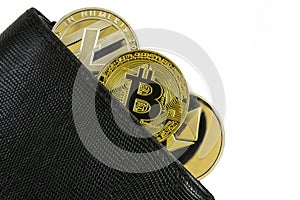 Litecoin, bitcoin and ethereum lie in black leather wallet closeup