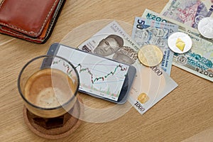 Litecoin, ethereum, bitcoin, banknotes, glass of photo