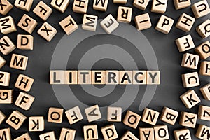 literacy - word from wooden blocks with letters