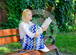 Literary critic. Lady pretty bookworm busy read book outdoors sunny day. Woman concentrated reading book in garden