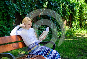 Literary critic. Lady pretty bookworm busy read book outdoors sunny day. Woman concentrated reading book in garden. Girl