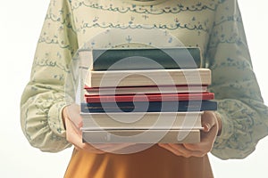 Literary moment woman holds stack of books, closeup shot