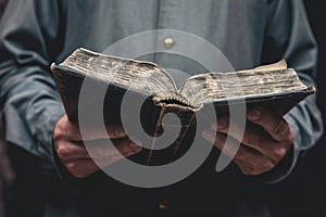 Literary touch Hand holding a book in a classic pose