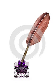 Literature concept. Fountain pen with feather near inkstand isolated on white