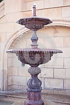 Lithic fountain with dripping water photo