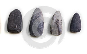 Lithic tools. Four stone chisels photo