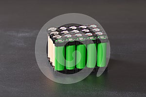 Lithium battery pack in black plastic holder on the dark background