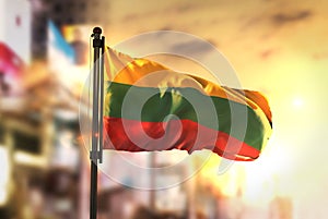 Lithuania Flag Against City Blurred Background At Sunrise Backlight