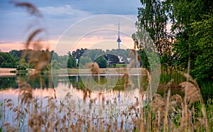 Lithuanian landscape of lake and tv tower visible