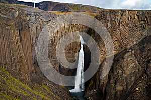 Litlanesfoss waterfall and basalt columns in Iceland