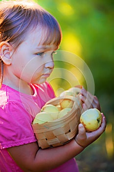 Litle girl with apples