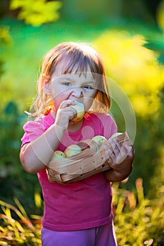 Litle girl with apples